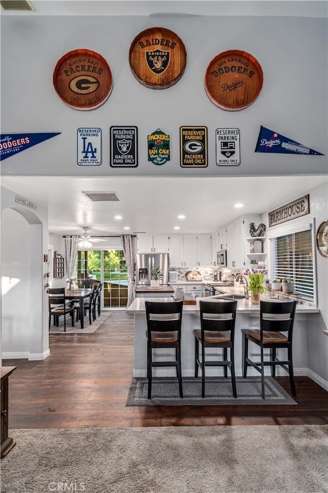 42311 Camden Way, Lancaster, CA 93536 - kitchen featuring stainless steel appliances, open shelves, white cabinets, light countertops, and a high ceiling