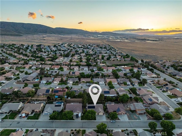 42311 Camden Way, Lancaster, CA 93536 - aerial view of property's location featuring a mountain backdrop and nearby suburban area