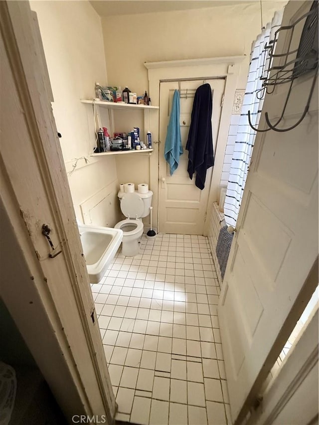 415417 Euclid Ave, Los Angeles, CA 90063 - bathroom featuring tile patterned flooring and toilet