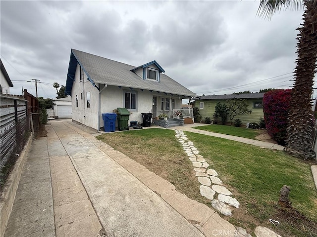 415417 Euclid Ave, Los Angeles, CA 90063 - bungalow featuring stucco siding, an outbuilding, a garage, a shingled roof, and a porch