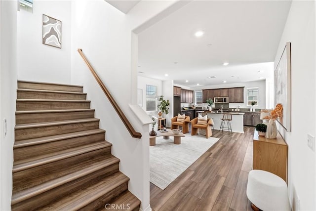 16725 Petrus Ln, Fontana, CA 92336 - stairway featuring wood finished floors and recessed lighting
