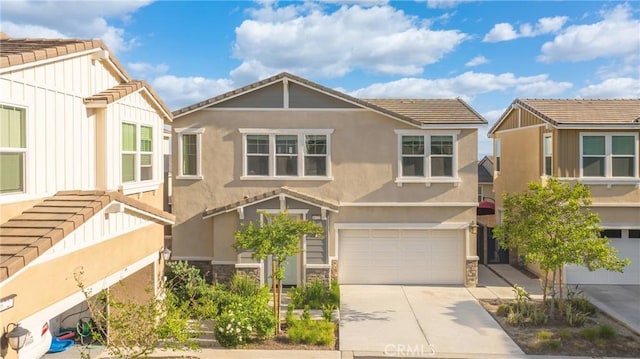 16725 Petrus Ln, Fontana, CA 92336 - view of front of home featuring a tile roof, stone siding, and a garage