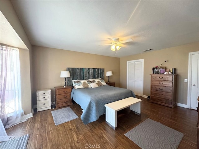 7425 I Ave, Hesperia, CA 92345 - bedroom featuring multiple windows, dark wood-style flooring, baseboards, and a closet