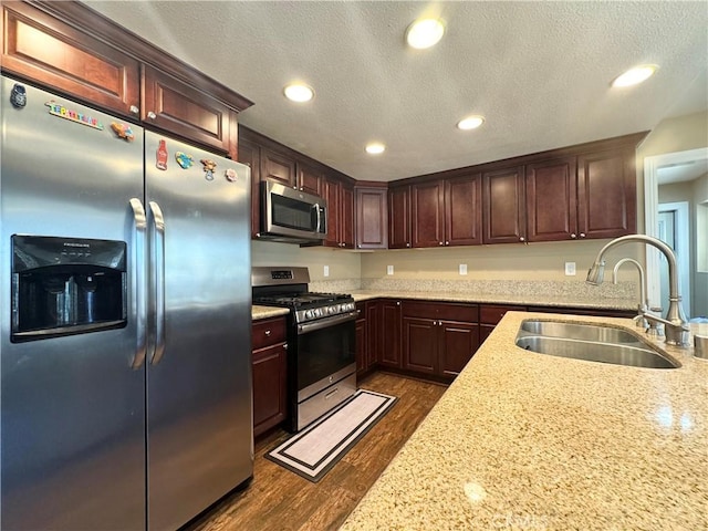 7425 I Ave, Hesperia, CA 92345 - kitchen featuring stainless steel appliances, a sink, dark wood-style flooring, recessed lighting, and a textured ceiling