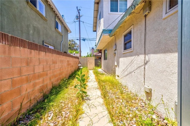 9419 Bartley Ave, Santa Fe Springs, CA 90670 - view of side of home featuring stucco siding