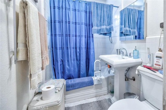 9419 Bartley Ave, Santa Fe Springs, CA 90670 - bathroom with tile walls, toilet, tile patterned flooring, and shower / tub combo with curtain