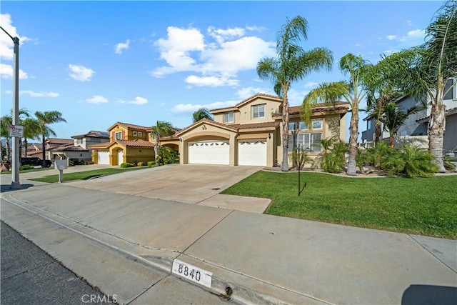 8840 Greenlawn St, Riverside, CA 92508 - mediterranean / spanish home featuring stucco siding, concrete driveway, a tiled roof, a front lawn, and a residential view