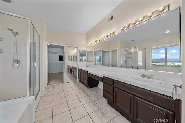 8840 Greenlawn St, Riverside, CA 92508 - bathroom featuring a shower stall, double vanity, tile patterned floors, and a spacious closet