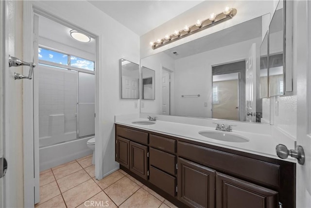 8840 Greenlawn St, Riverside, CA 92508 - full bathroom featuring double vanity, toilet, tile patterned floors, and shower / bath combination with glass door