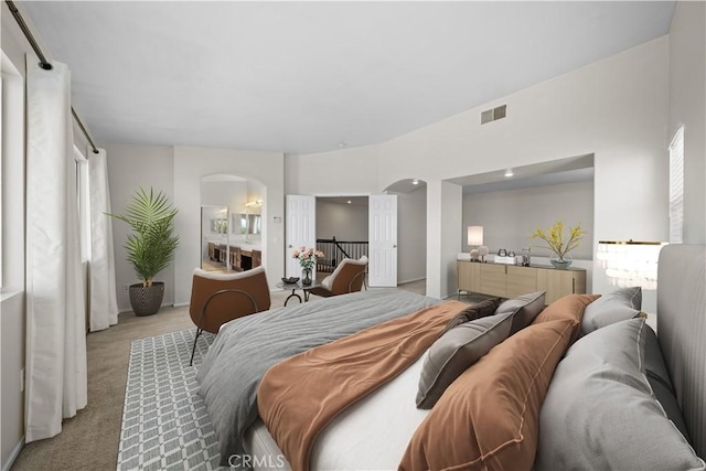 8840 Greenlawn St, Riverside, CA 92508 - bedroom featuring arched walkways, light colored carpet, and baseboards