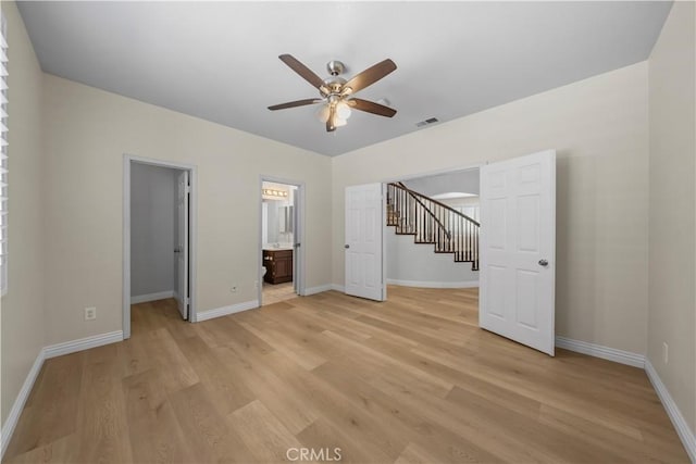 8840 Greenlawn St, Riverside, CA 92508 - unfurnished bedroom featuring light wood finished floors, a spacious closet, baseboards, and ensuite bathroom