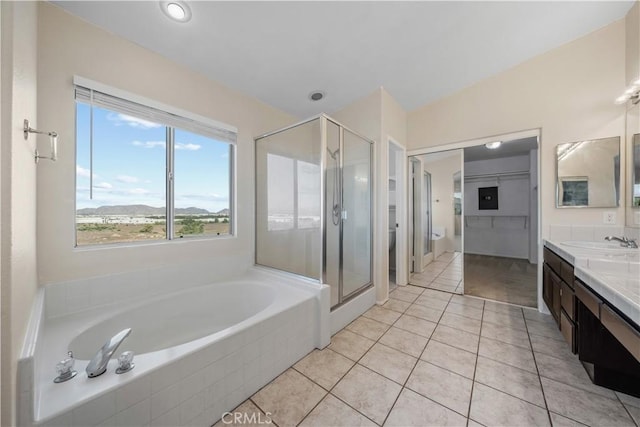 8840 Greenlawn St, Riverside, CA 92508 - bathroom featuring double vanity, a bath, a shower stall, tile patterned floors, and toilet