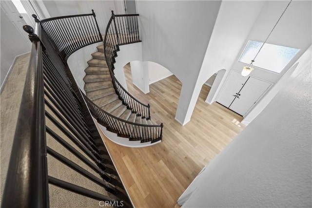8840 Greenlawn St, Riverside, CA 92508 - staircase featuring wood finished floors, baseboards, and arched walkways