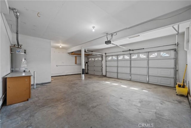 8840 Greenlawn St, Riverside, CA 92508 - garage with strapped water heater and a garage door opener