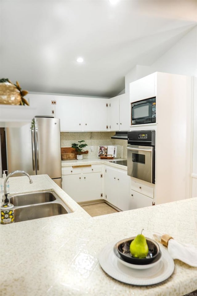 5283 Chollas Pkwy, San Diego, CA 92105 - kitchen featuring a sink, black appliances, light countertops, and lofted ceiling