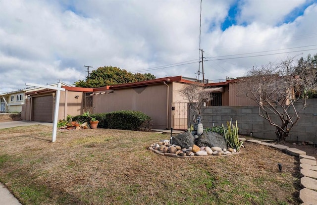 5283 Chollas Pkwy, San Diego, CA 92105 - view of property exterior with an attached garage and concrete driveway