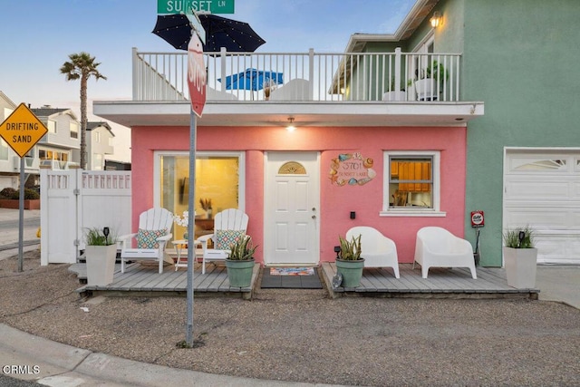 3701 Sunset Ln, Oxnard, CA 93035 - doorway to property with a balcony and stucco siding
