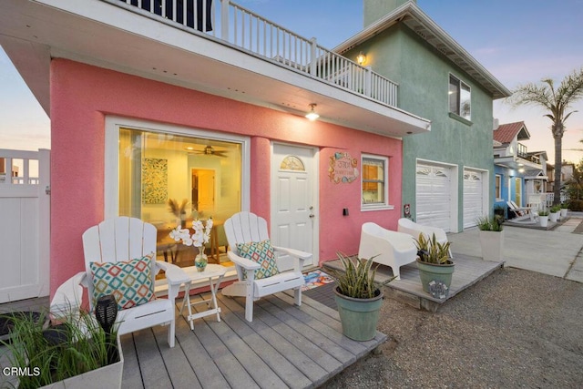 3701 Sunset Ln, Oxnard, CA 93035 - deck at dusk featuring an attached garage