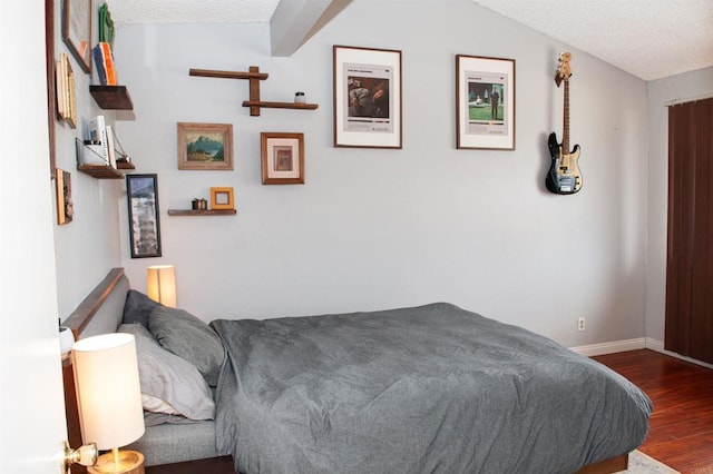 1523 E Windsor Rd Unit 105B, Glendale, CA 91205 - bedroom with wood finished floors, baseboards, and a textured ceiling