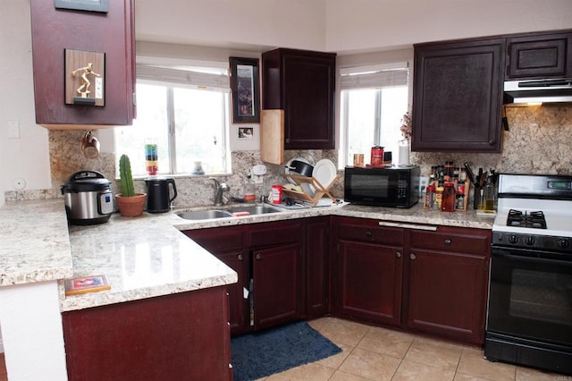1523 E Windsor Rd Unit 105B, Glendale, CA 91205 - kitchen featuring black microwave, gas stove, under cabinet range hood, and light countertops