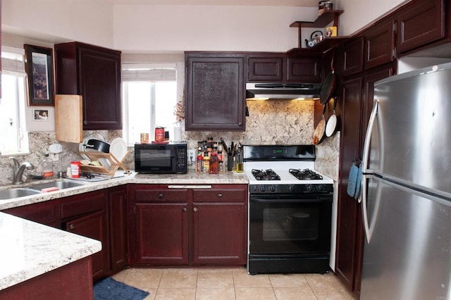 1523 E Windsor Rd Unit 105B, Glendale, CA 91205 - kitchen featuring freestanding refrigerator, gas stove, under cabinet range hood, black microwave, and a sink
