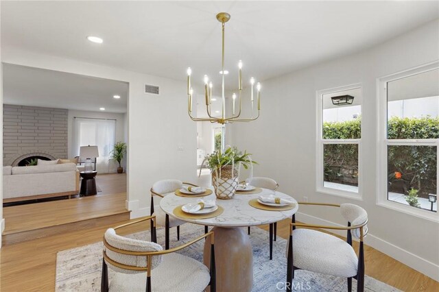 7848 Calmcrest Dr, Downey, CA 90240 - dining space featuring healthy amount of natural light, baseboards, light wood-style floors, a chandelier, and recessed lighting
