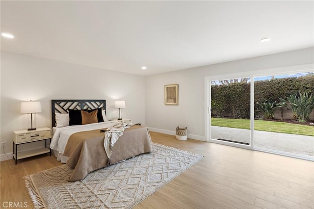 7848 Calmcrest Dr, Downey, CA 90240 - bedroom featuring access to exterior, wood finished floors, recessed lighting, and baseboards