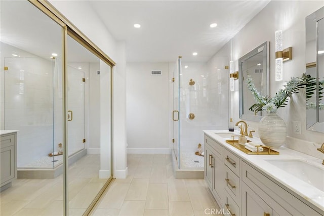 7848 Calmcrest Dr, Downey, CA 90240 - bathroom with a stall shower, double vanity, recessed lighting, and tile patterned flooring