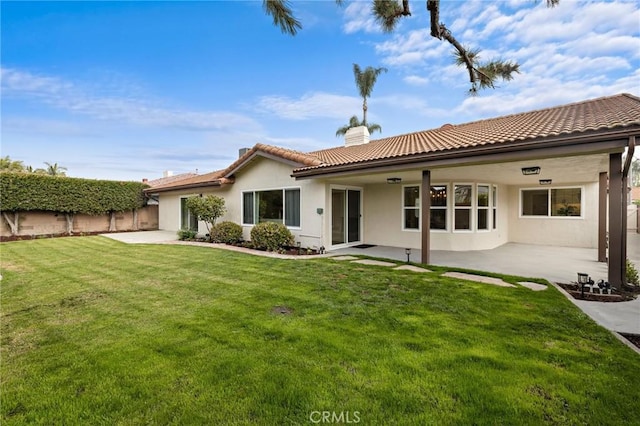 7848 Calmcrest Dr, Downey, CA 90240 - back of house with a chimney, a patio area, stucco siding, and a tile roof