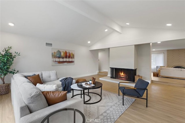 7848 Calmcrest Dr, Downey, CA 90240 - living area with a multi sided fireplace, light wood-type flooring, recessed lighting, and baseboards