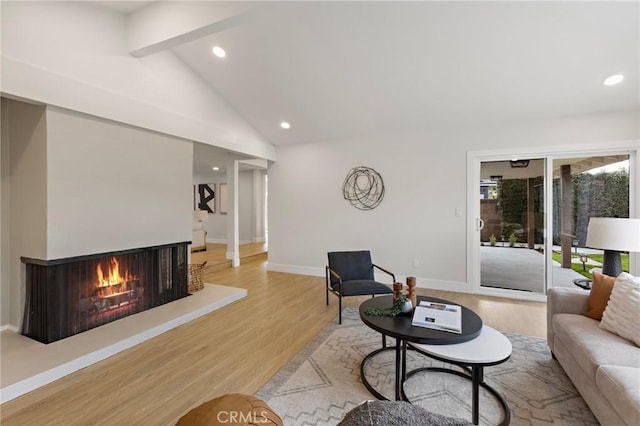 7848 Calmcrest Dr, Downey, CA 90240 - living room featuring wood finished floors, recessed lighting, a multi sided fireplace, and baseboards