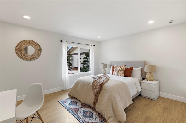 7848 Calmcrest Dr, Downey, CA 90240 - bedroom featuring baseboards, light wood-style floors, and recessed lighting