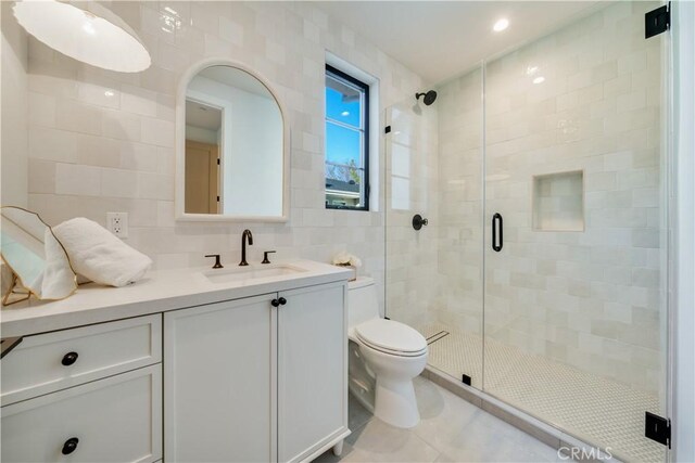 4634 Vesper Ave, Sherman Oaks, CA 91403 - full bath featuring tile walls, vanity, a shower stall, and tile patterned floors