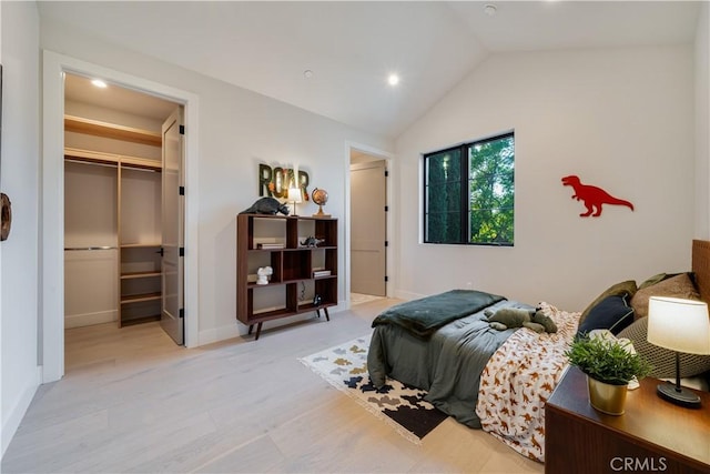 4634 Vesper Ave, Sherman Oaks, CA 91403 - bedroom with a walk in closet, vaulted ceiling, recessed lighting, light wood-style floors, and baseboards