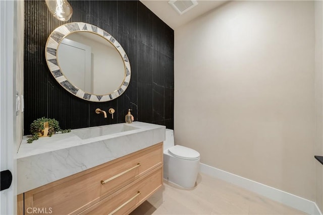 4634 Vesper Ave, Sherman Oaks, CA 91403 - bathroom with toilet, vanity, and baseboards