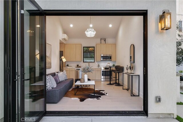 4634 Vesper Ave, Sherman Oaks, CA 91403 - living room featuring baseboards and light wood-style floors