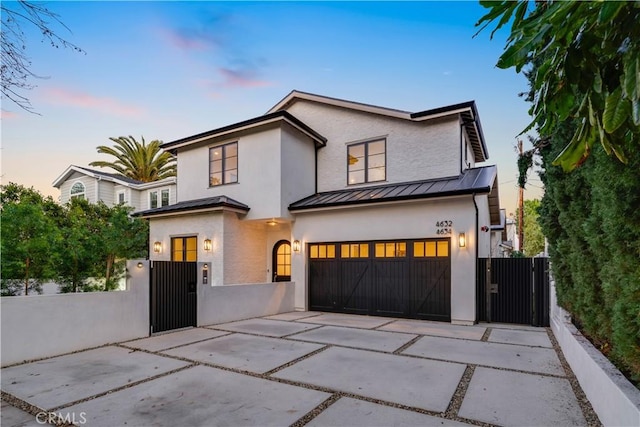 4634 Vesper Ave, Sherman Oaks, CA 91403 - view of front of house featuring a gate, a standing seam roof, stucco siding, and an attached garage