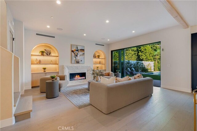 4634 Vesper Ave, Sherman Oaks, CA 91403 - living area featuring light wood-style floors, a fireplace, built in features, recessed lighting, and beamed ceiling