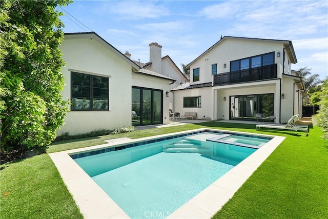 4634 Vesper Ave, Sherman Oaks, CA 91403 - back of house with french doors, a balcony, a yard, and stucco siding