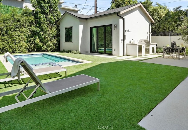 4634 Vesper Ave, Sherman Oaks, CA 91403 - back of property with area for grilling, stucco siding, and a patio area