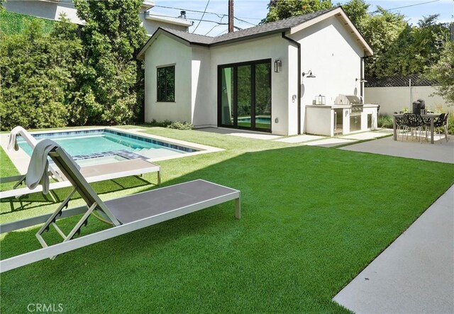 4634 Vesper Ave, Sherman Oaks, CA 91403 - back of property featuring exterior kitchen, stucco siding, and a patio area