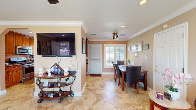 14862 Temple Ave, La Puente, CA 91744 - dining space featuring baseboards, crown molding, a ceiling fan, recessed lighting, and arched walkways