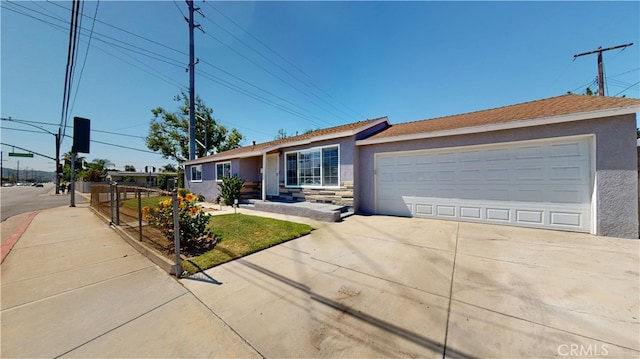 14862 Temple Ave, La Puente, CA 91744 - single story home with stucco siding, stone siding, concrete driveway, and a garage