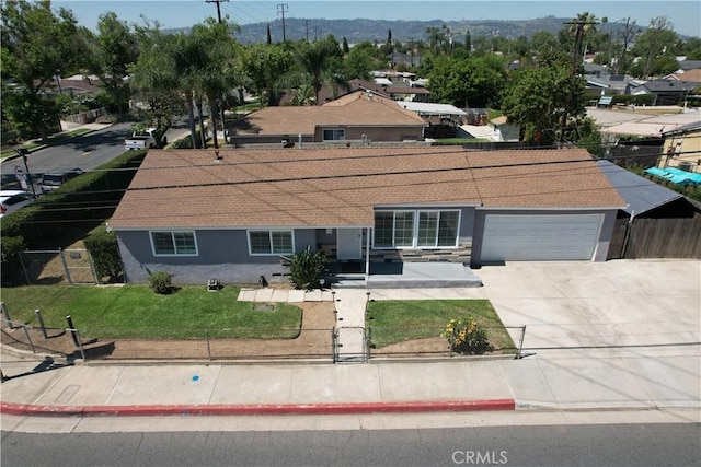 14862 Temple Ave, La Puente, CA 91744 - single story home featuring an attached garage, stucco siding, driveway, a shingled roof, and stone siding