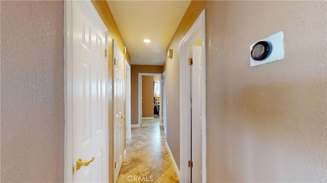 14862 Temple Ave, La Puente, CA 91744 - hallway with baseboards, a textured wall, recessed lighting, and light tile patterned floors