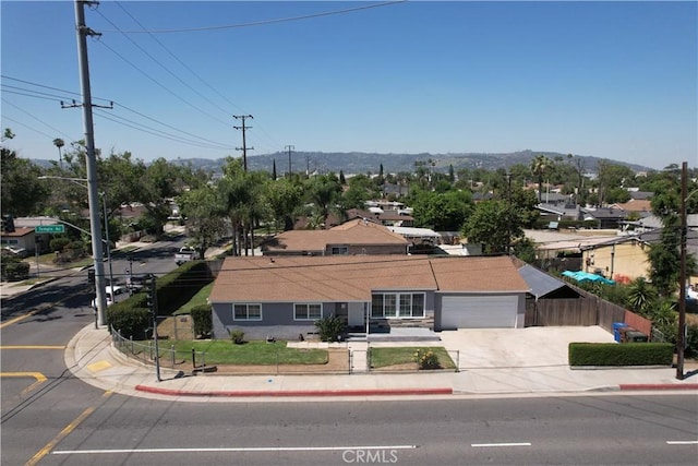 14862 Temple Ave, La Puente, CA 91744 - view of front of property featuring concrete driveway, a garage, and a mountain view