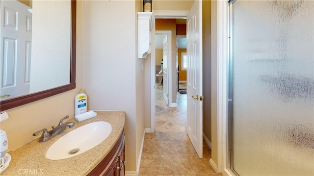 14862 Temple Ave, La Puente, CA 91744 - bathroom with a stall shower, vanity, and tile patterned floors