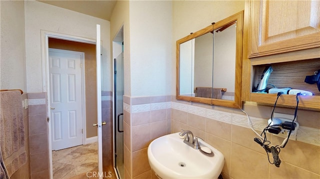 14862 Temple Ave, La Puente, CA 91744 - bathroom with a sink, a stall shower, and tile walls