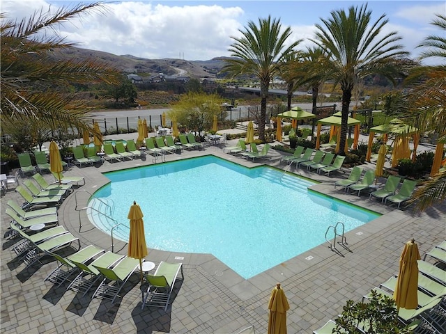 1101 Lasso Way Unit 303, Rancho Mission Viejo, CA 92694 - community pool with a patio and a mountain view