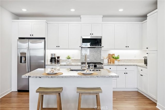 1101 Lasso Way Unit 303, Rancho Mission Viejo, CA 92694 - kitchen featuring appliances with stainless steel finishes, a sink, white cabinetry, and recessed lighting